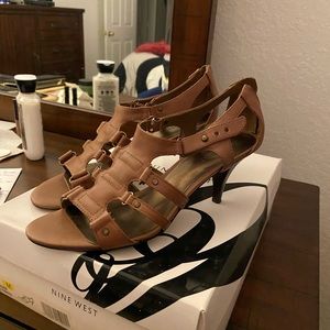 Tan Nine West sandal with a heel.
